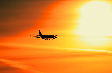 A sunset with a plane